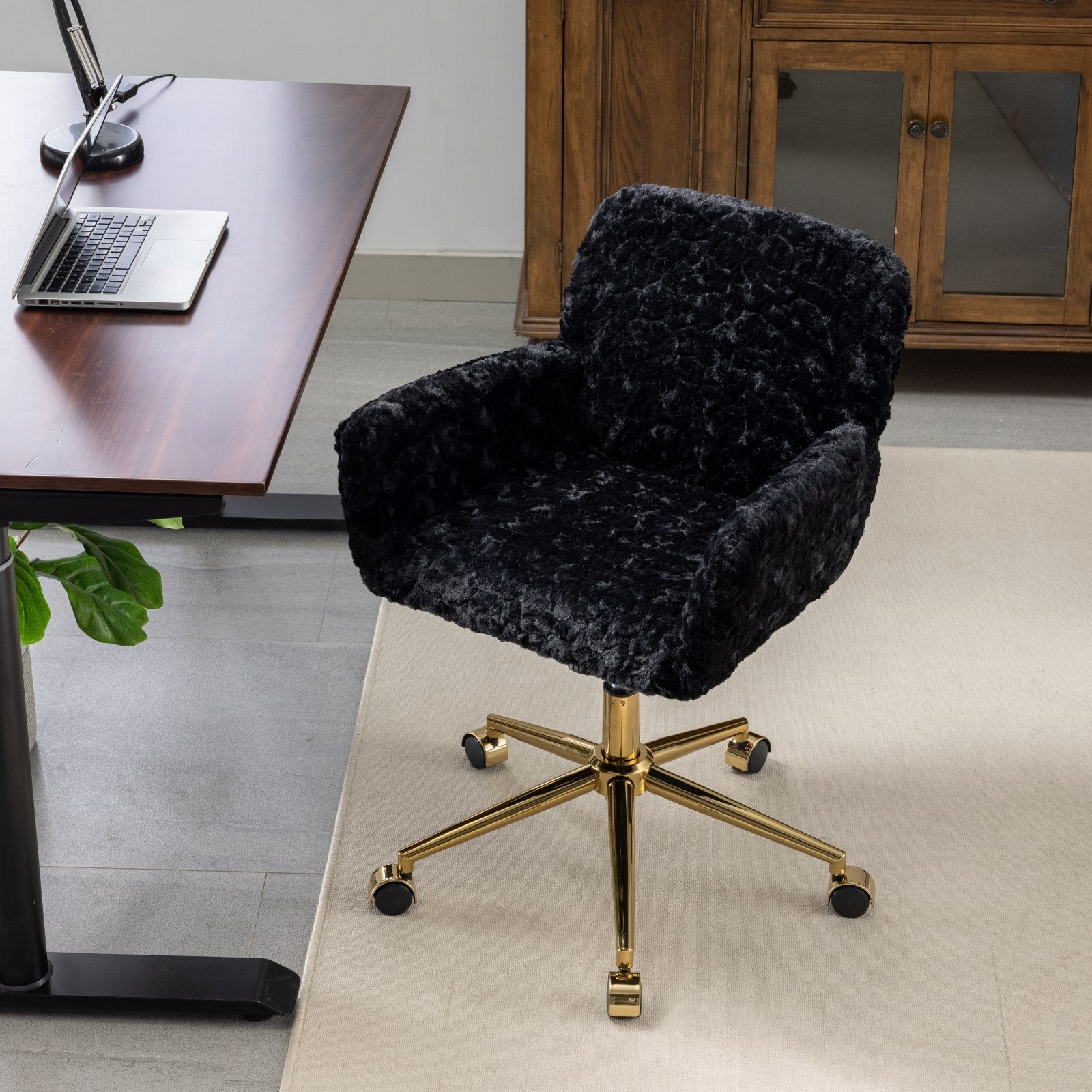 Adjustable reclining black faux fur desk chair