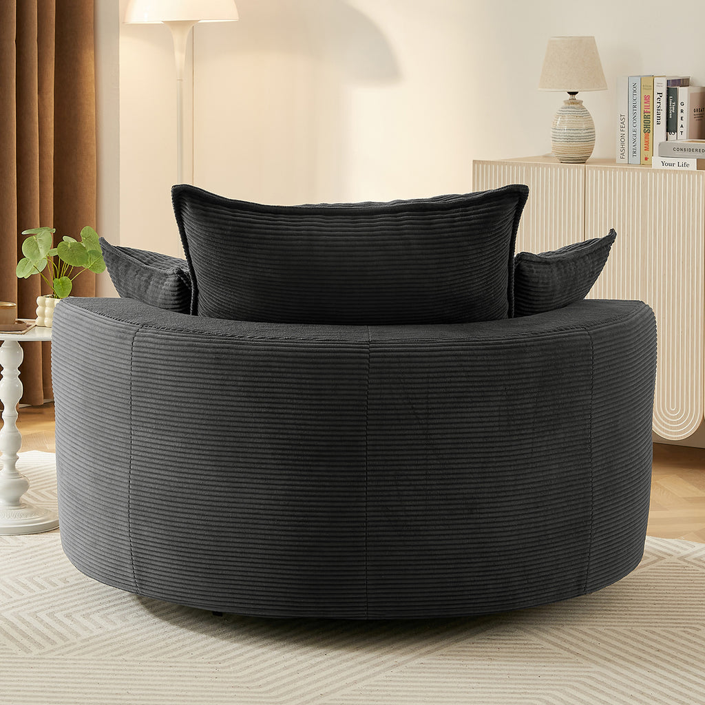 Black corduroy lounge chair in room setting