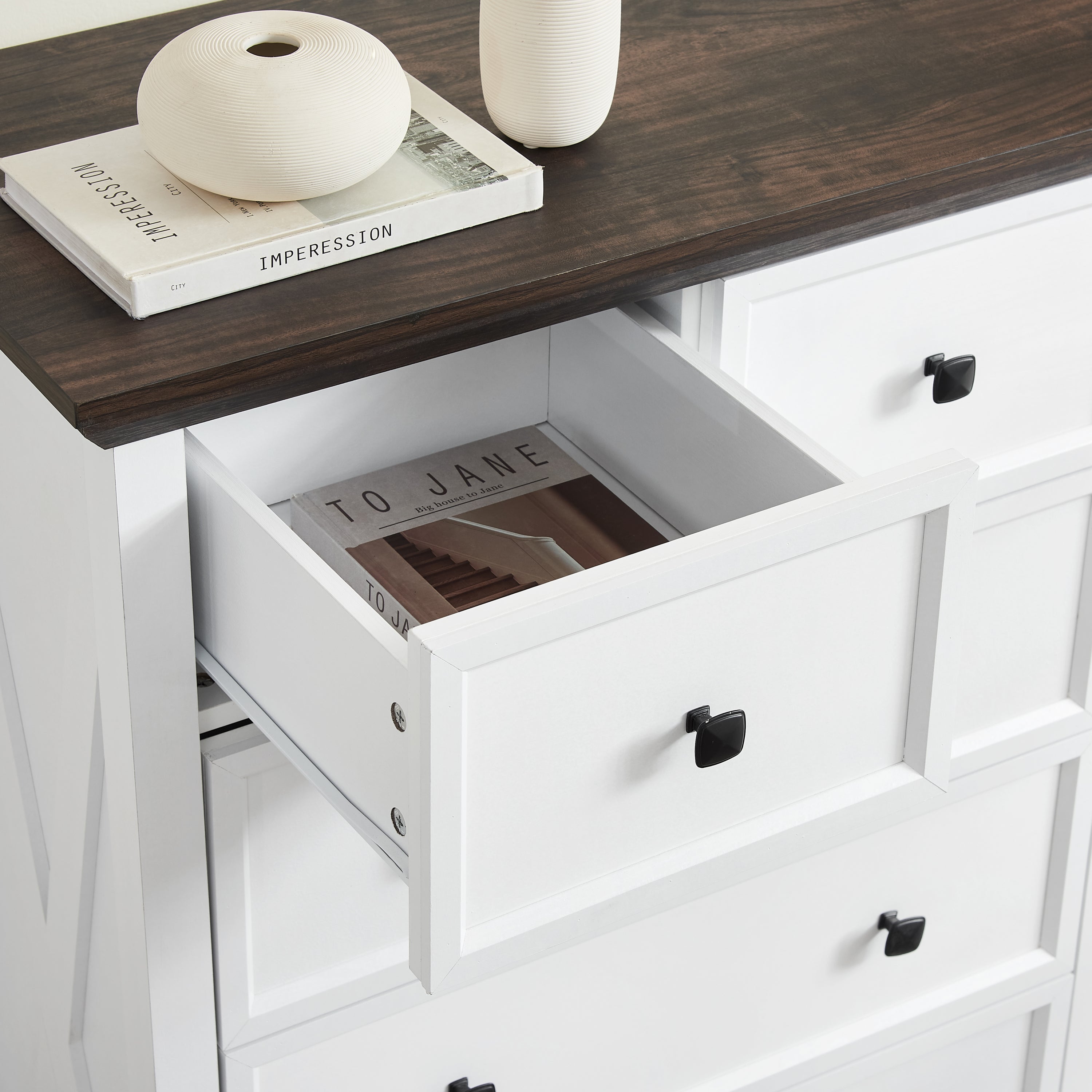 Modern metal handle detail on white dresser