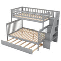 Gray twin over full bunk bed with trundle and staircase — front view