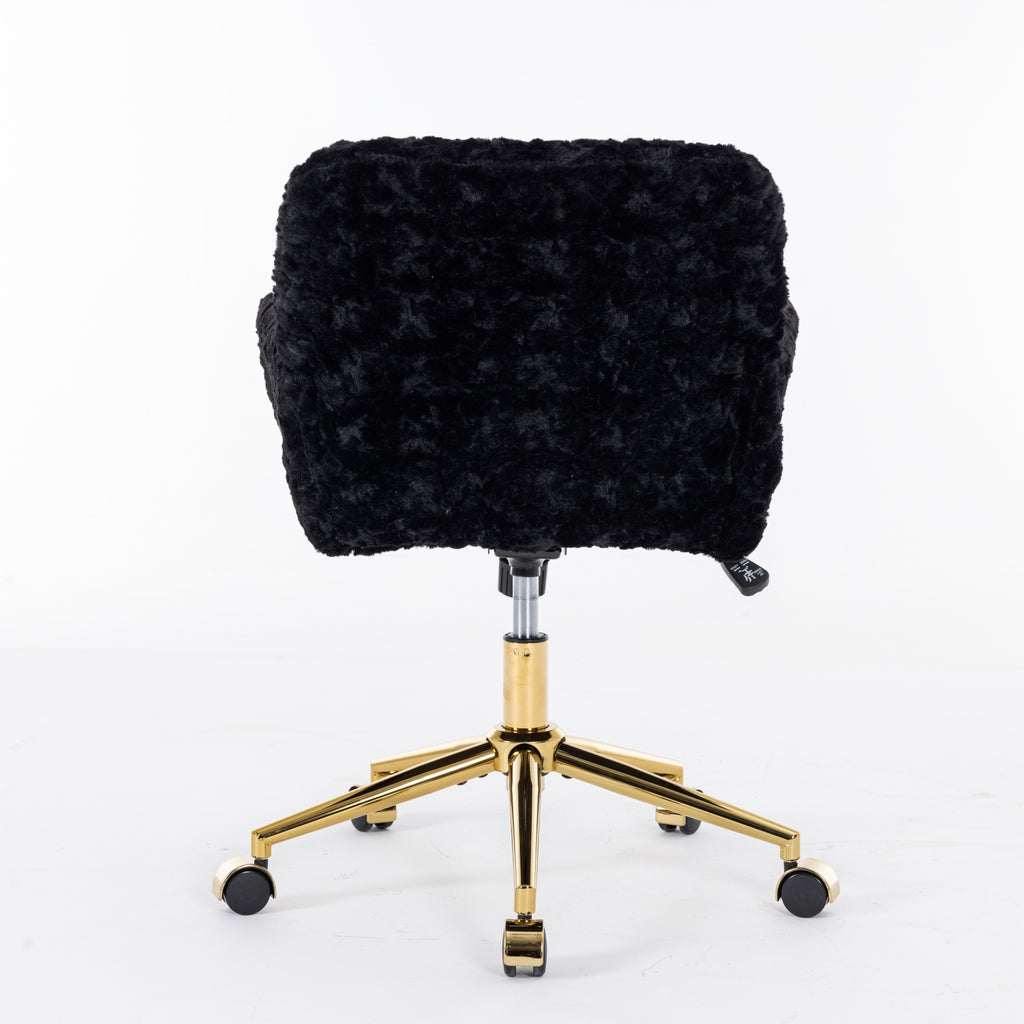 Gold metal base and wheel detail on black office chair