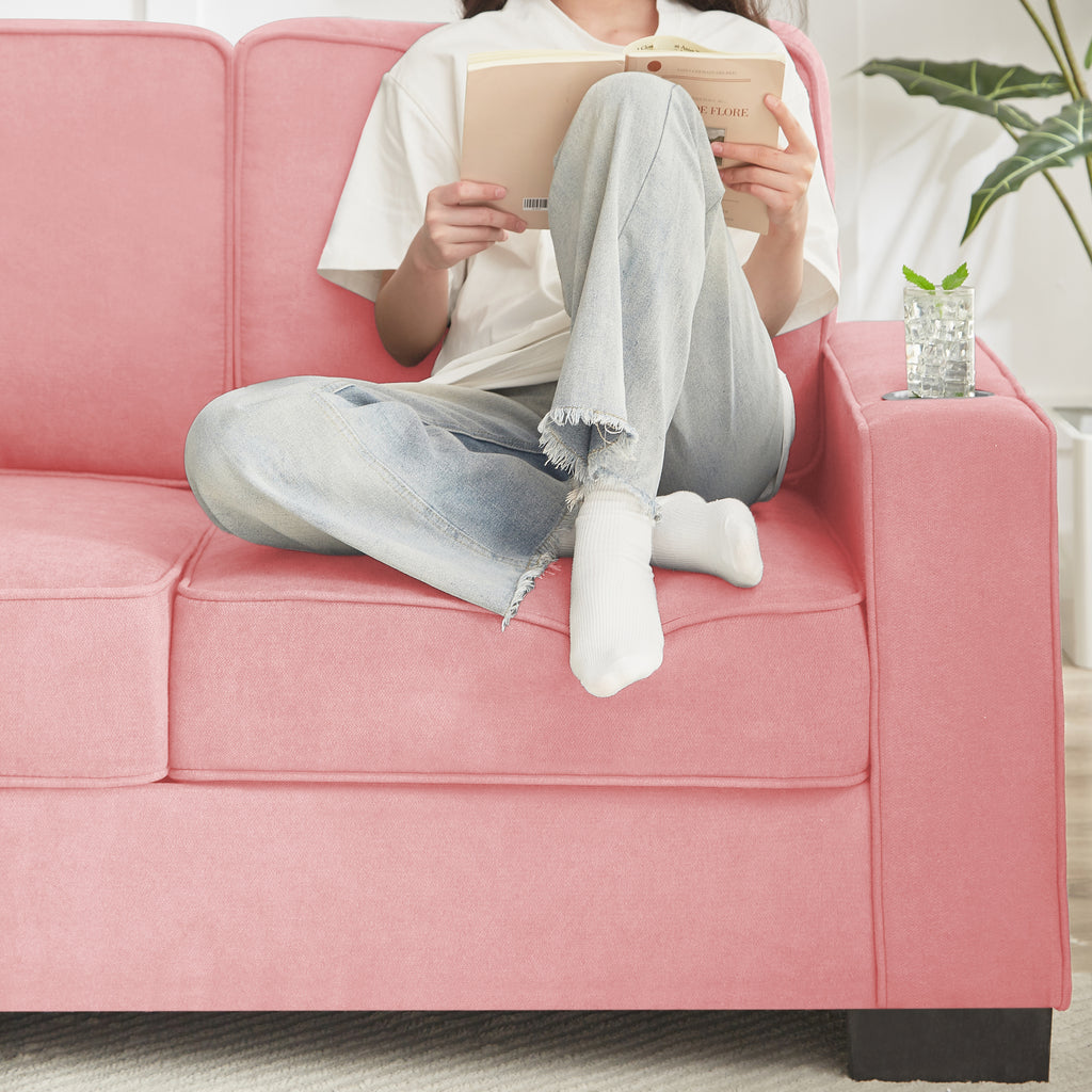 Modern pink sofa in bedroom setting