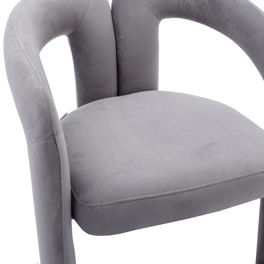 Gray velvet barrel chair elephant-foot leg detail