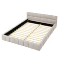 Beige queen upholstered platform bed — front view