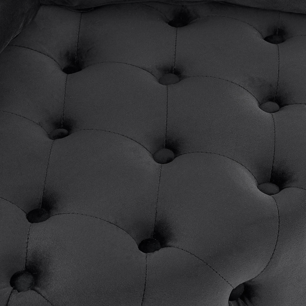 Black velvet tufted swivel chair in home office setting