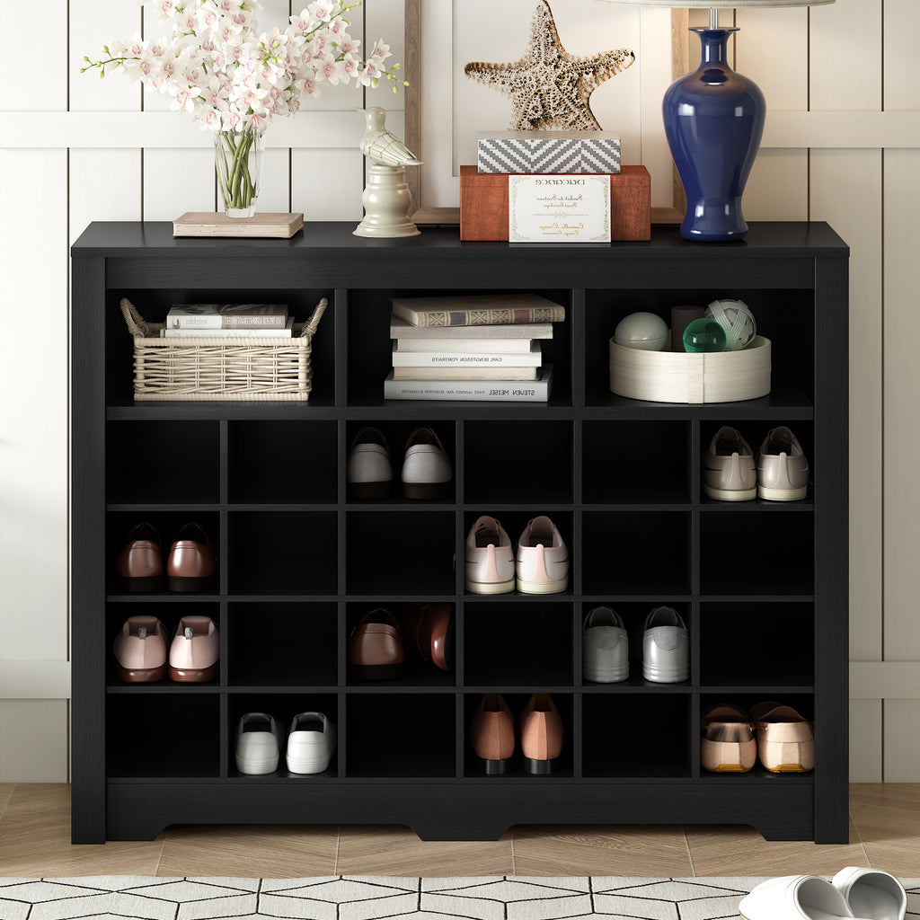 Modern black shoe cabinet with curved base — angle view