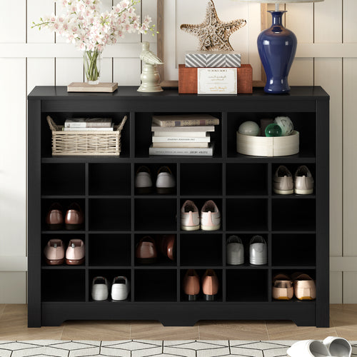 Modern black shoe cabinet with curved base — angle view