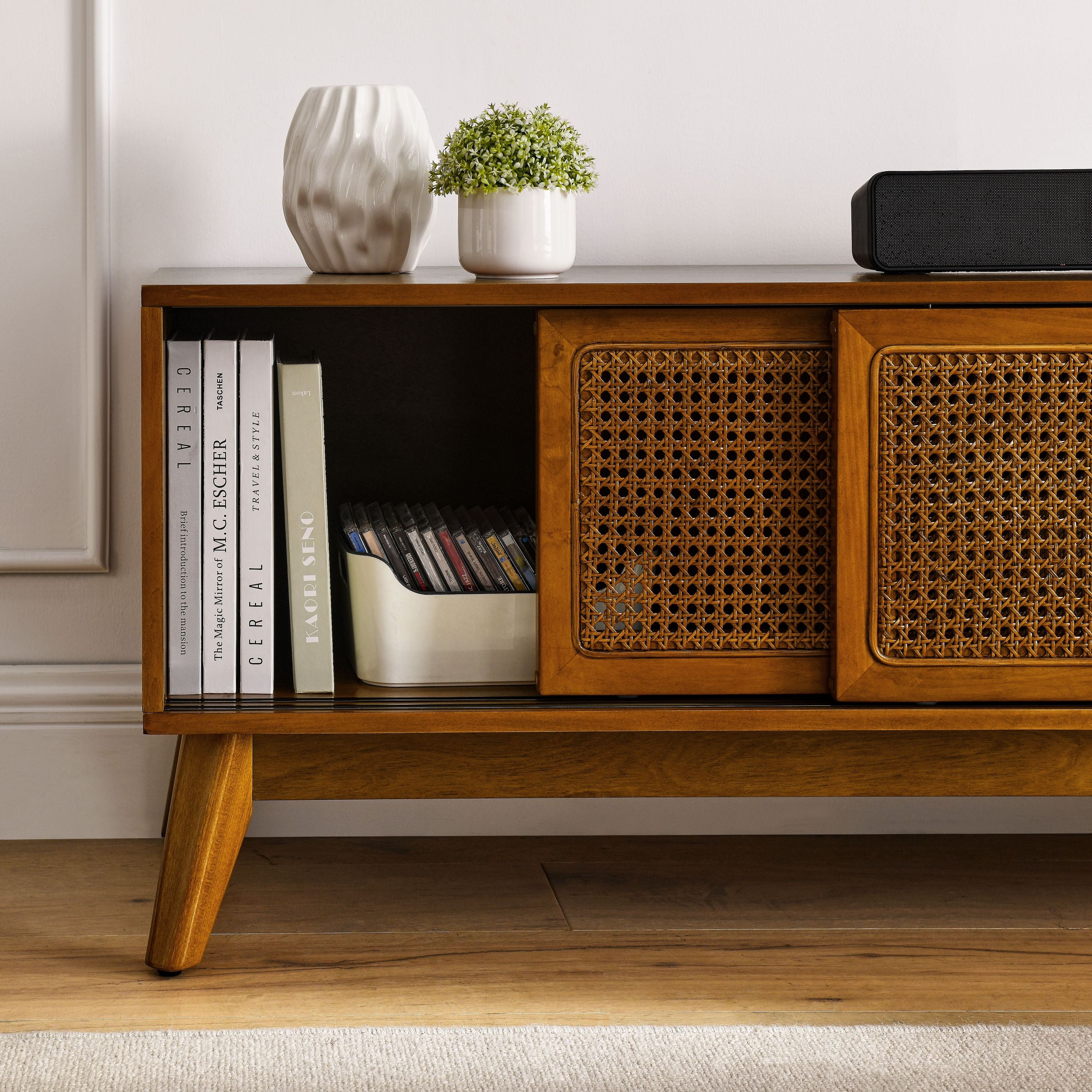 Light wood entertainment center with solid wood legs angle view