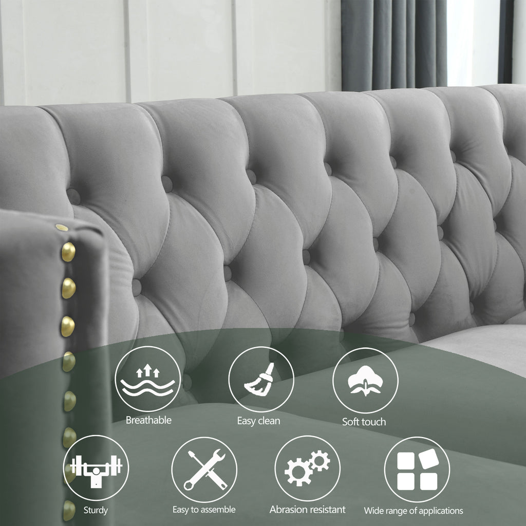 Grey Chesterfield sofa in bedroom or office setting