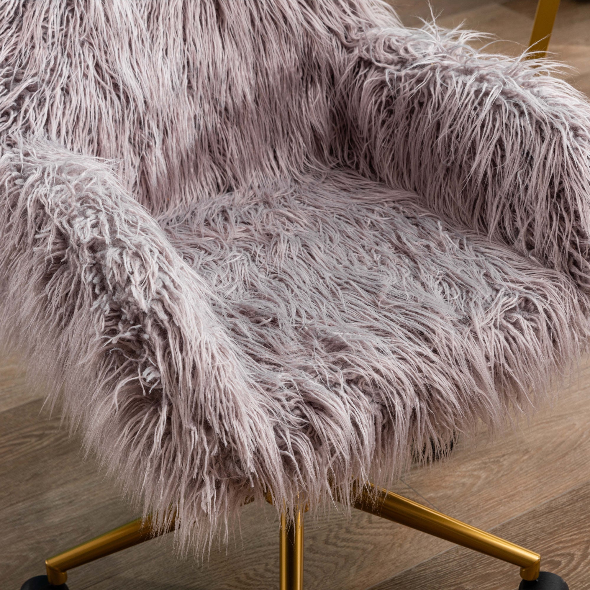 Adjustable gray faux fur desk chair angle view with swivel castors
