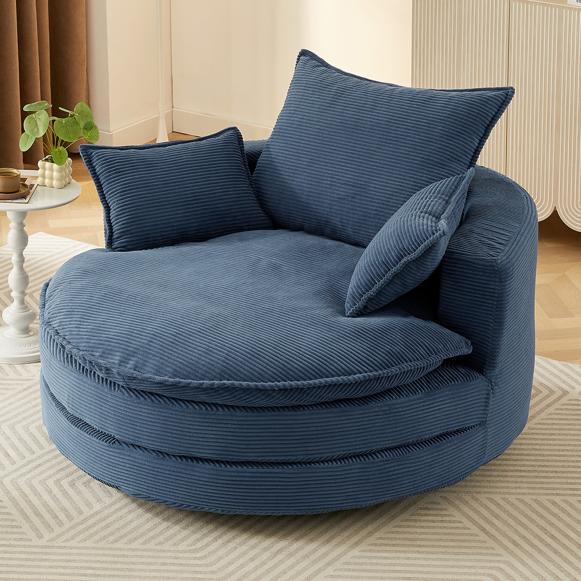 Oversized navy blue barrel chair 360 degree swivel base — angle view