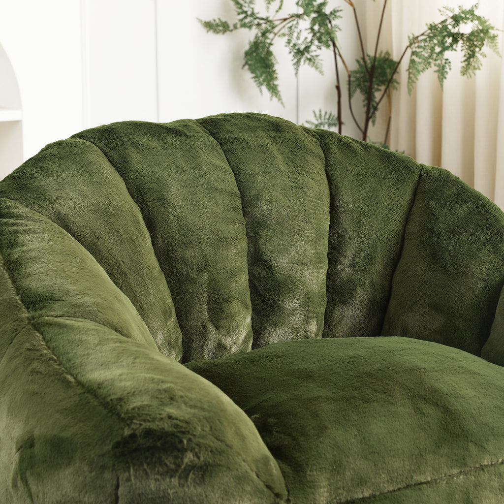 Green bean bag sofa chair in bedroom setting