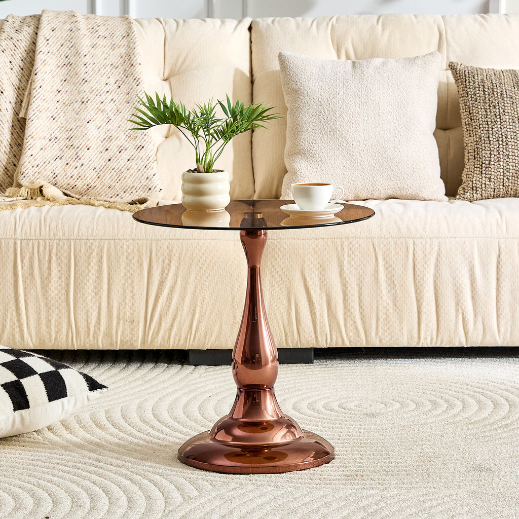Brown tempered glass round tabletop close-up on rose gold side table