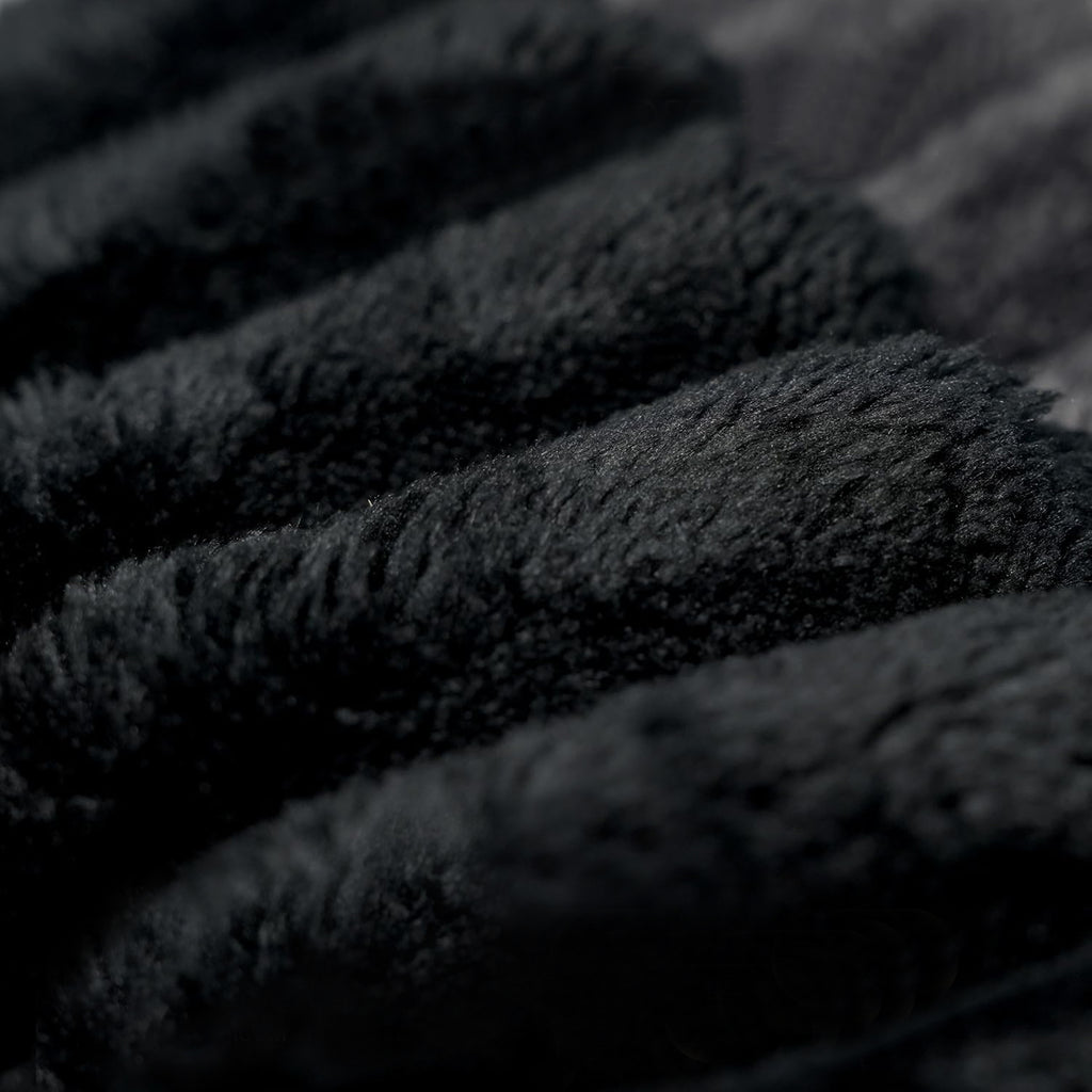 Black corduroy loveseat in conference or lounge setting