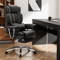 Black executive office chair with footrest — front view