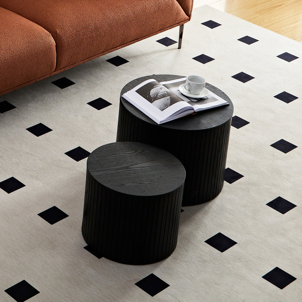 Round nesting coffee table black finish tabletop close-up