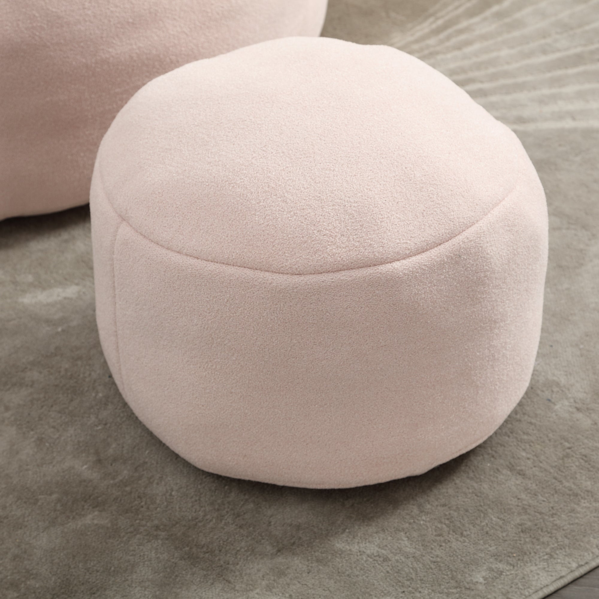 Lightweight pink bean bag chair moved to reading nook