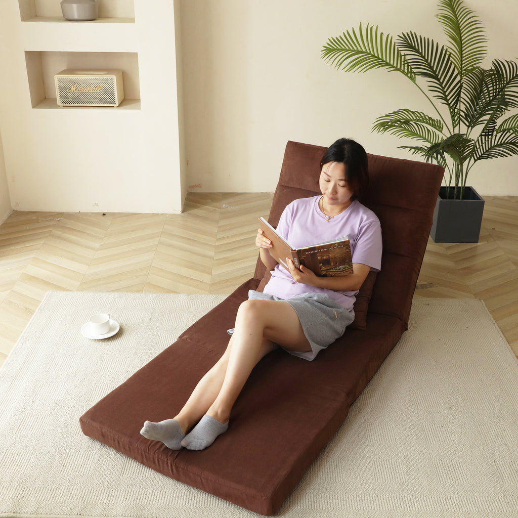 Included throw pillow on brown fold-down sofa bed