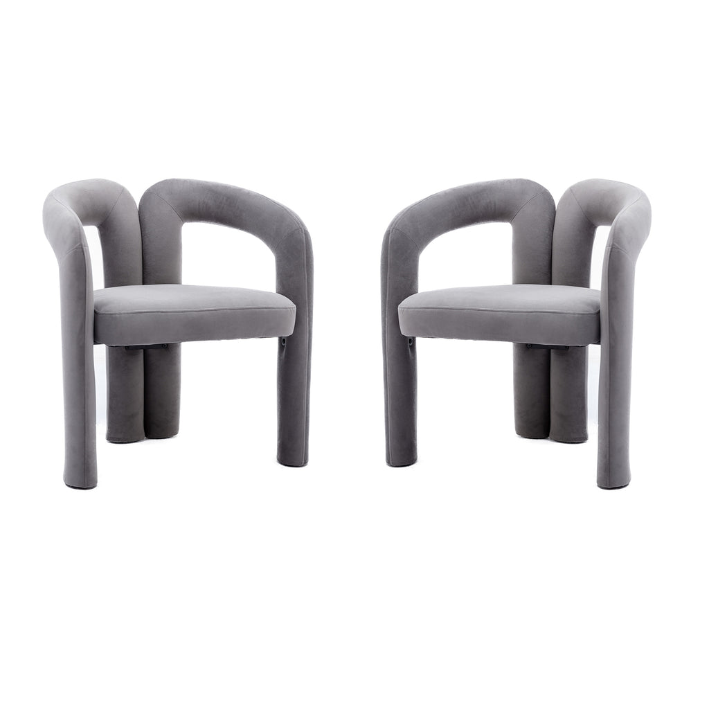 Gray velvet barrel dining chair with curved backrest — angle view