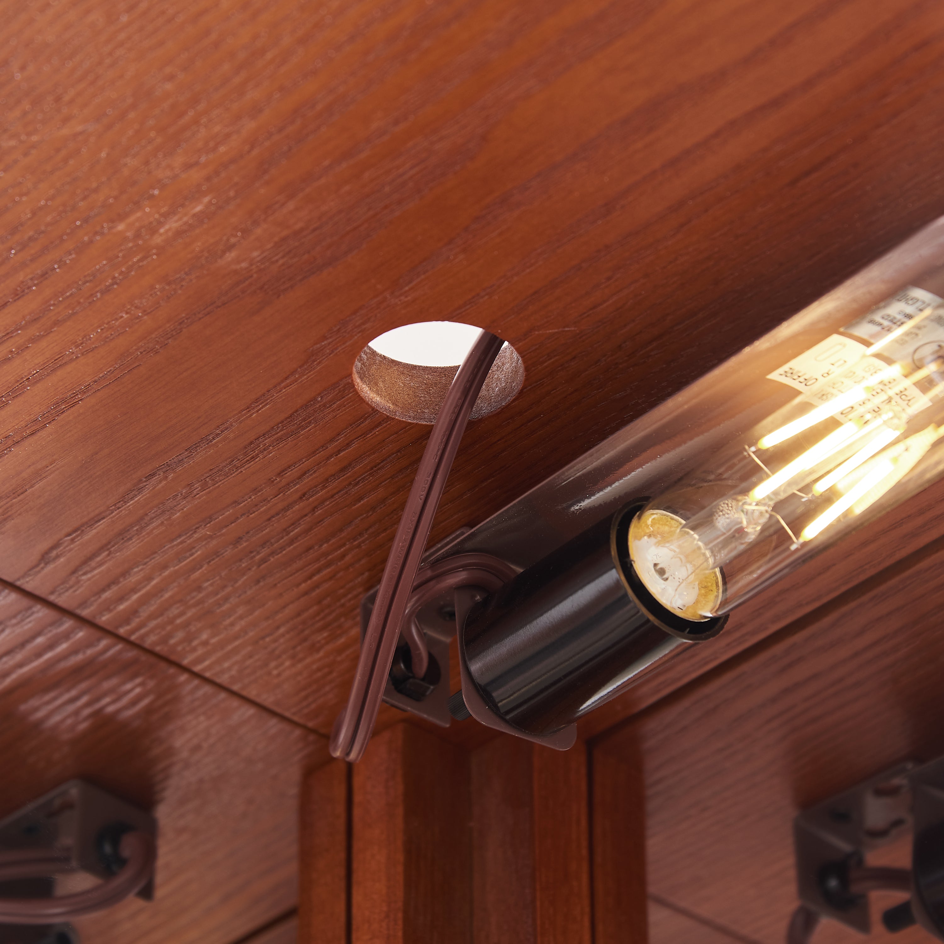 Oak curio cabinet anti-toppling wall anchor device
