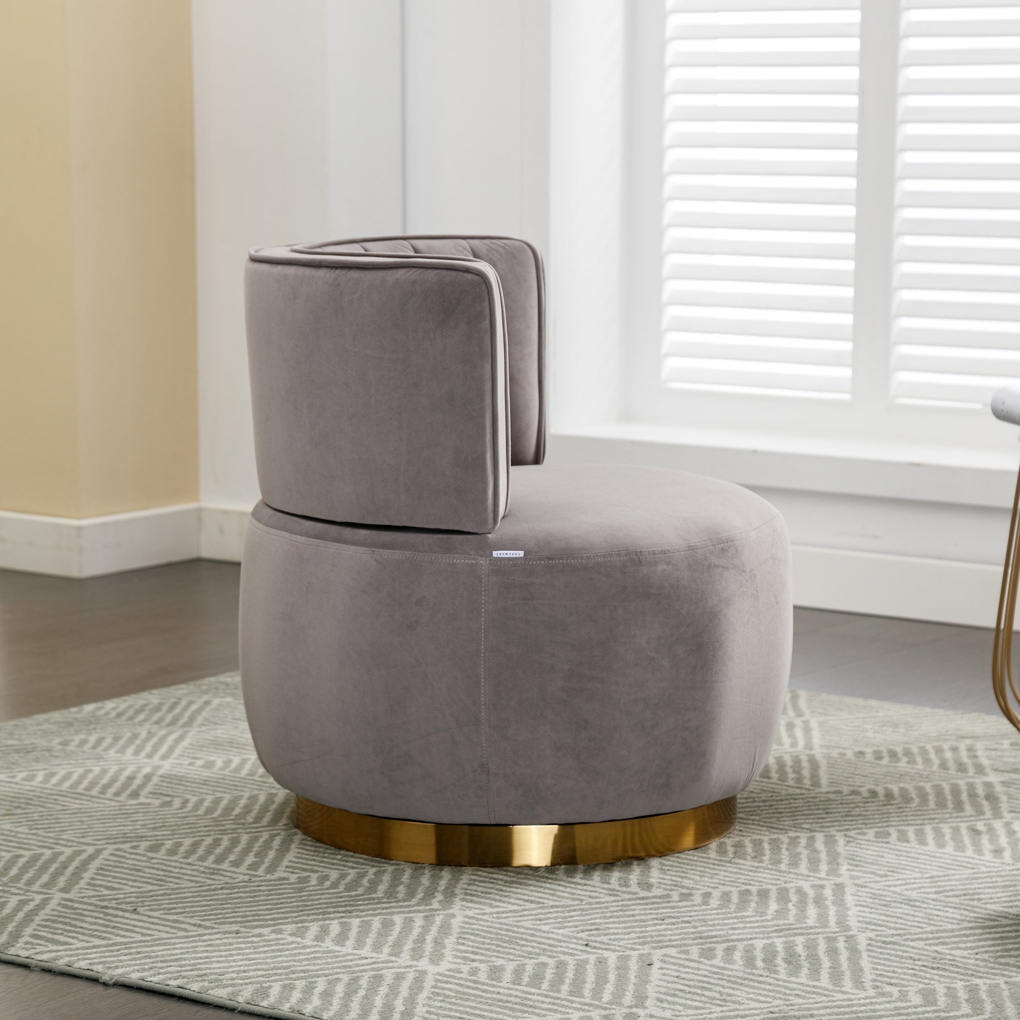 Swivel barrel chair in bedroom setting