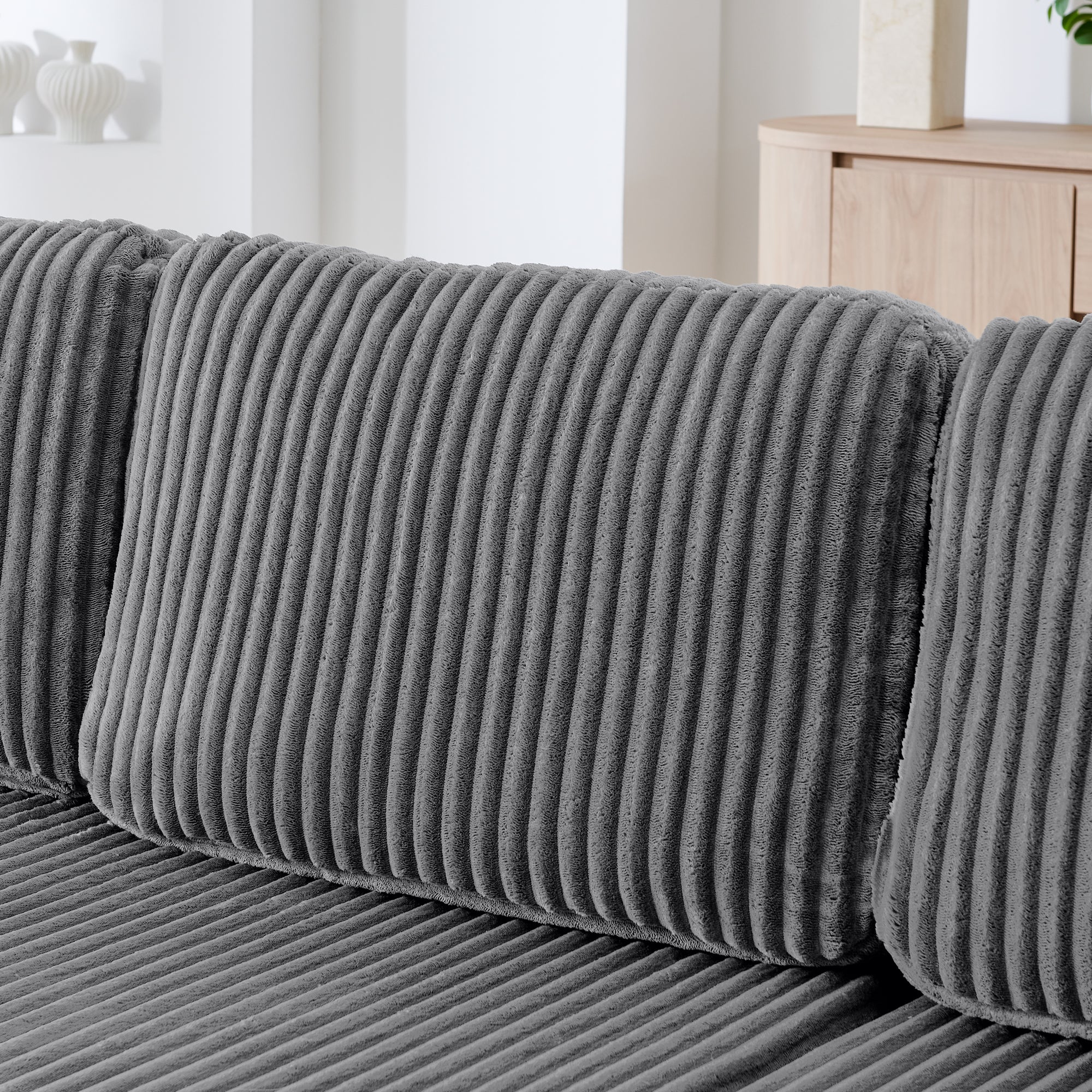 Grey corduroy upholstery texture close-up