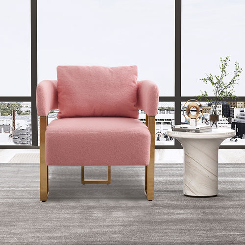 Pink accent chair with gold metal legs — angle view