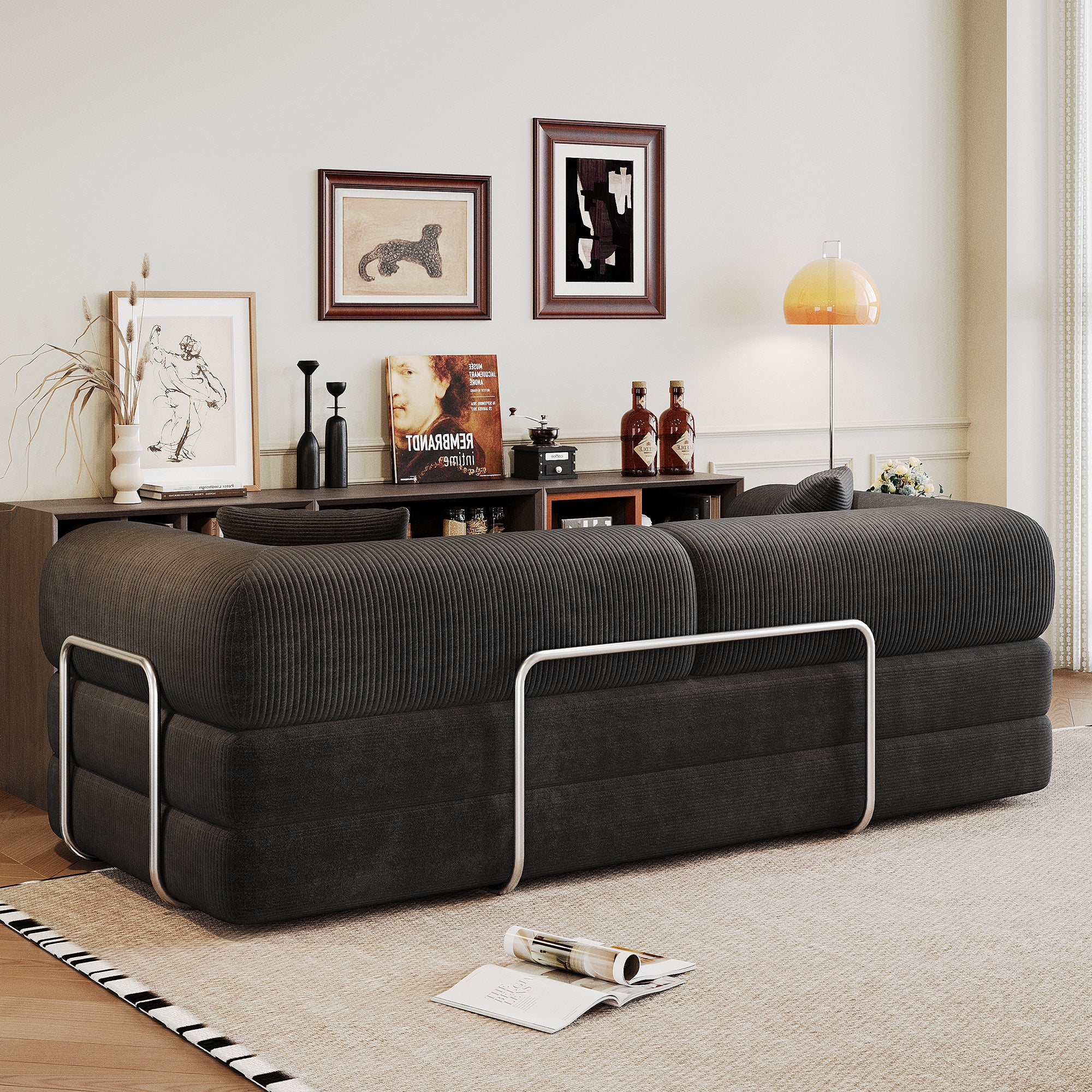 Black corduroy sofa bed in bedroom or apartment setting