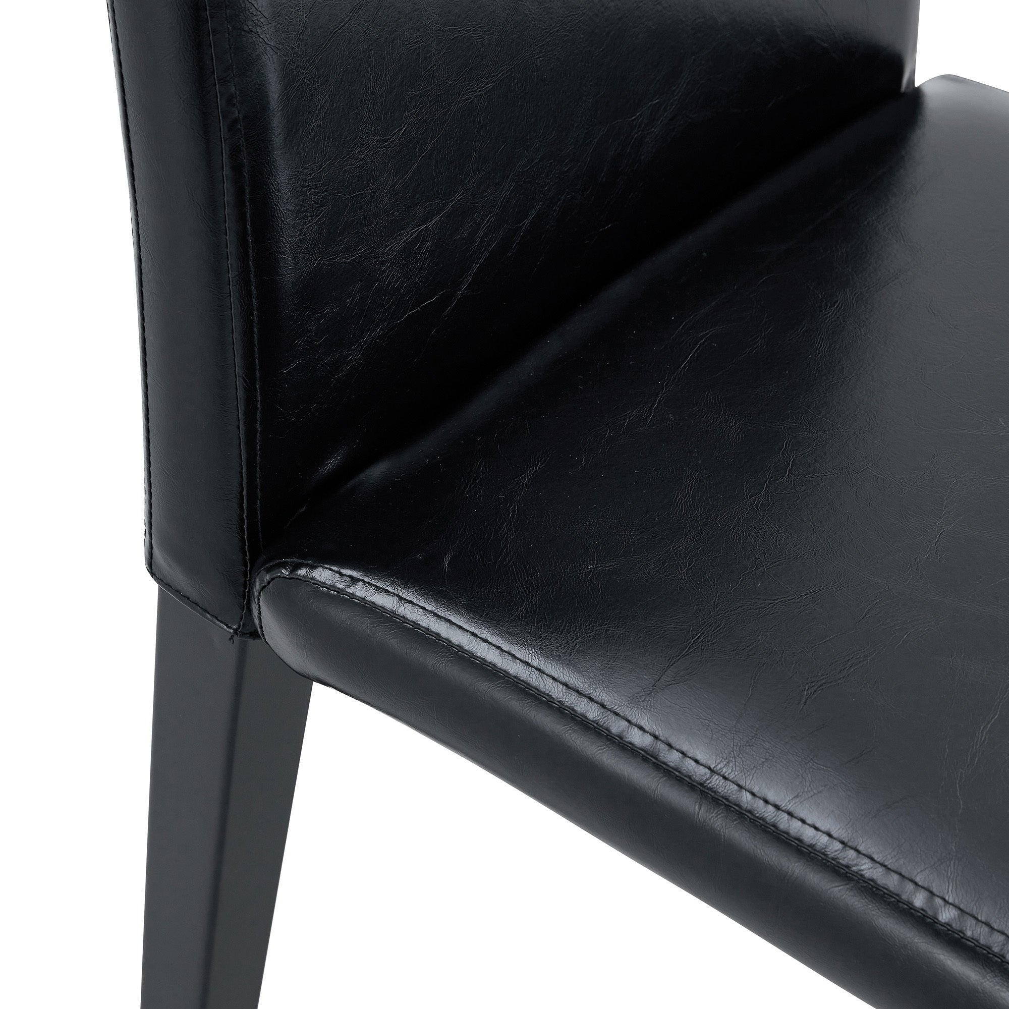 Table and chair set. 71 * 35.4 inch Wood grain MDF splicing desktop with X-shaped metal frame dining table.Includes 8 white PU dining chairs With Black Metal Legs.Making it an ideal choice for home.