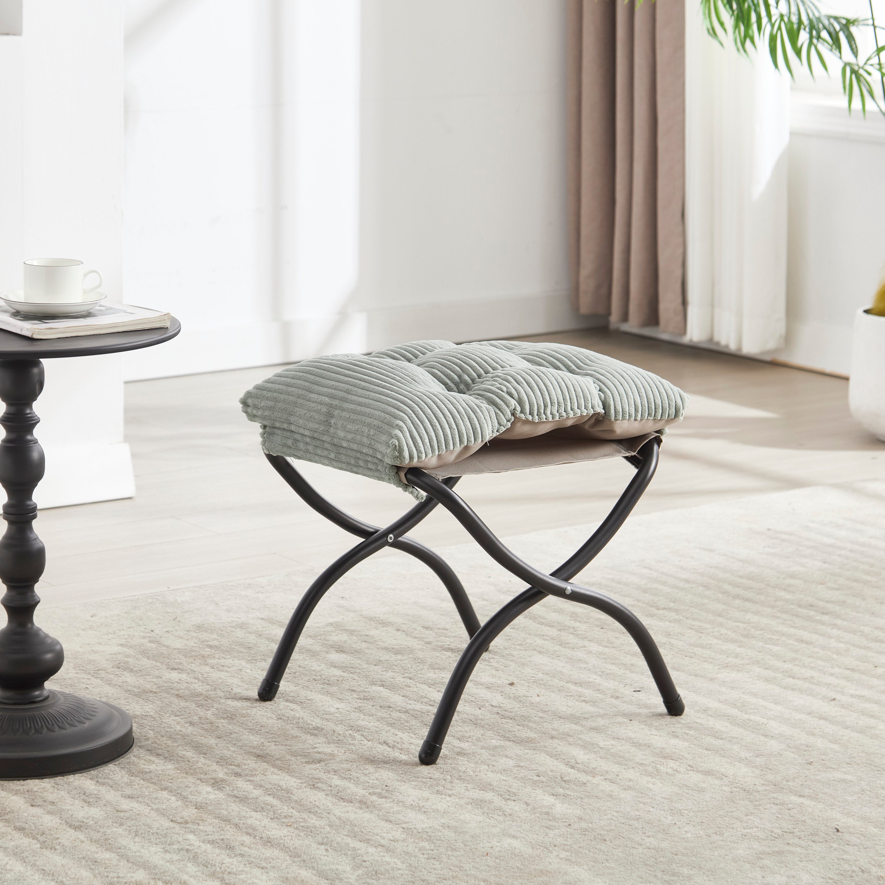 Light green lazy chair with steel frame — profile view