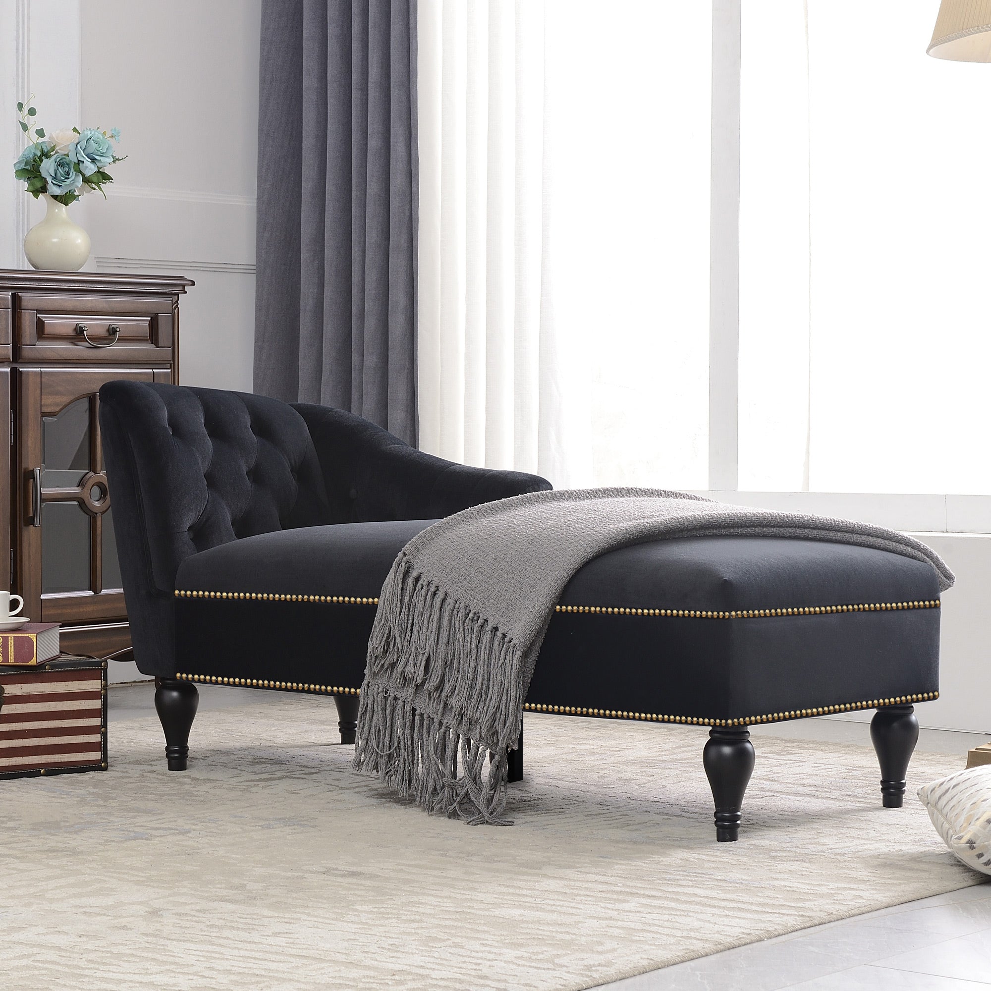 Black velvet chaise with nailhead trim detail