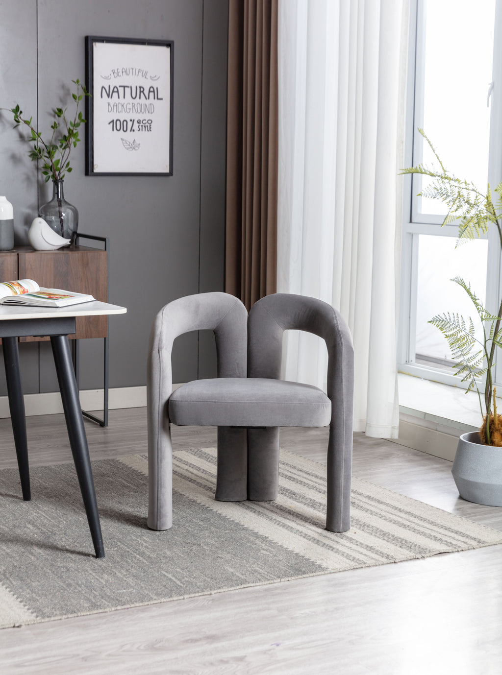 Gray velvet barrel seat dining chair in kitchen setting