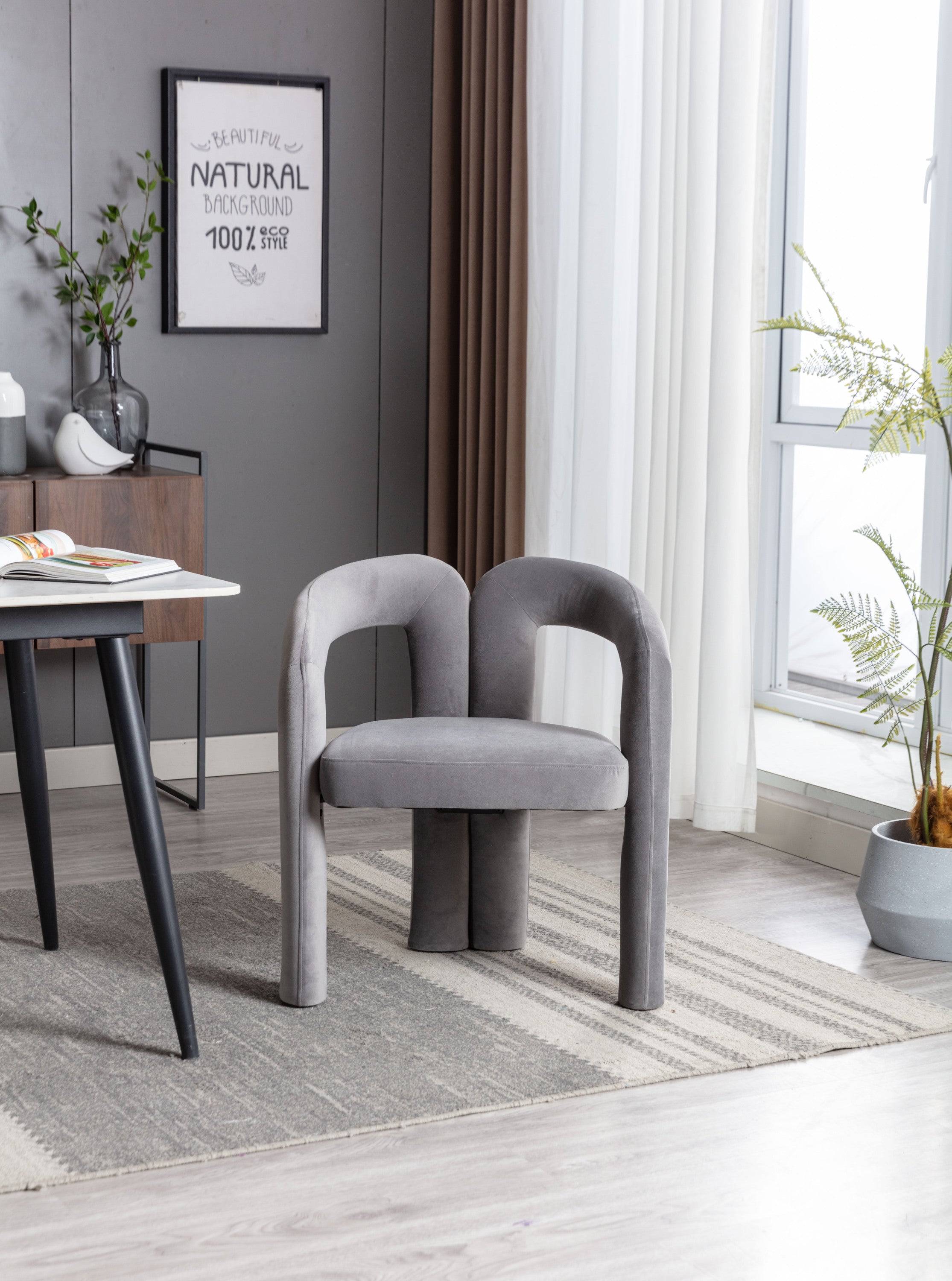 Gray velvet barrel seat dining chair in kitchen setting