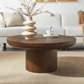 Dark brown round coffee table with cylindrical oak legs — front view