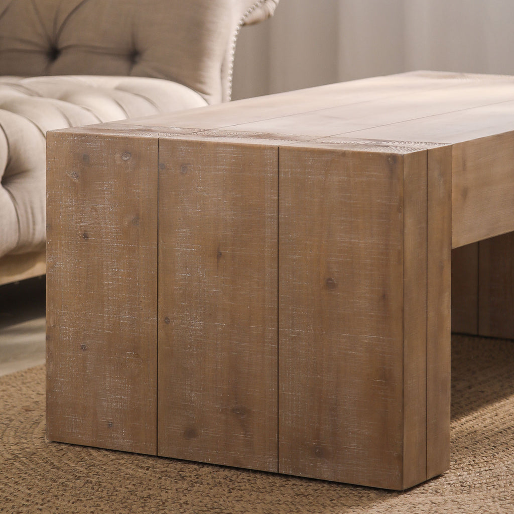 Natural wood coffee table in contemporary living room setting