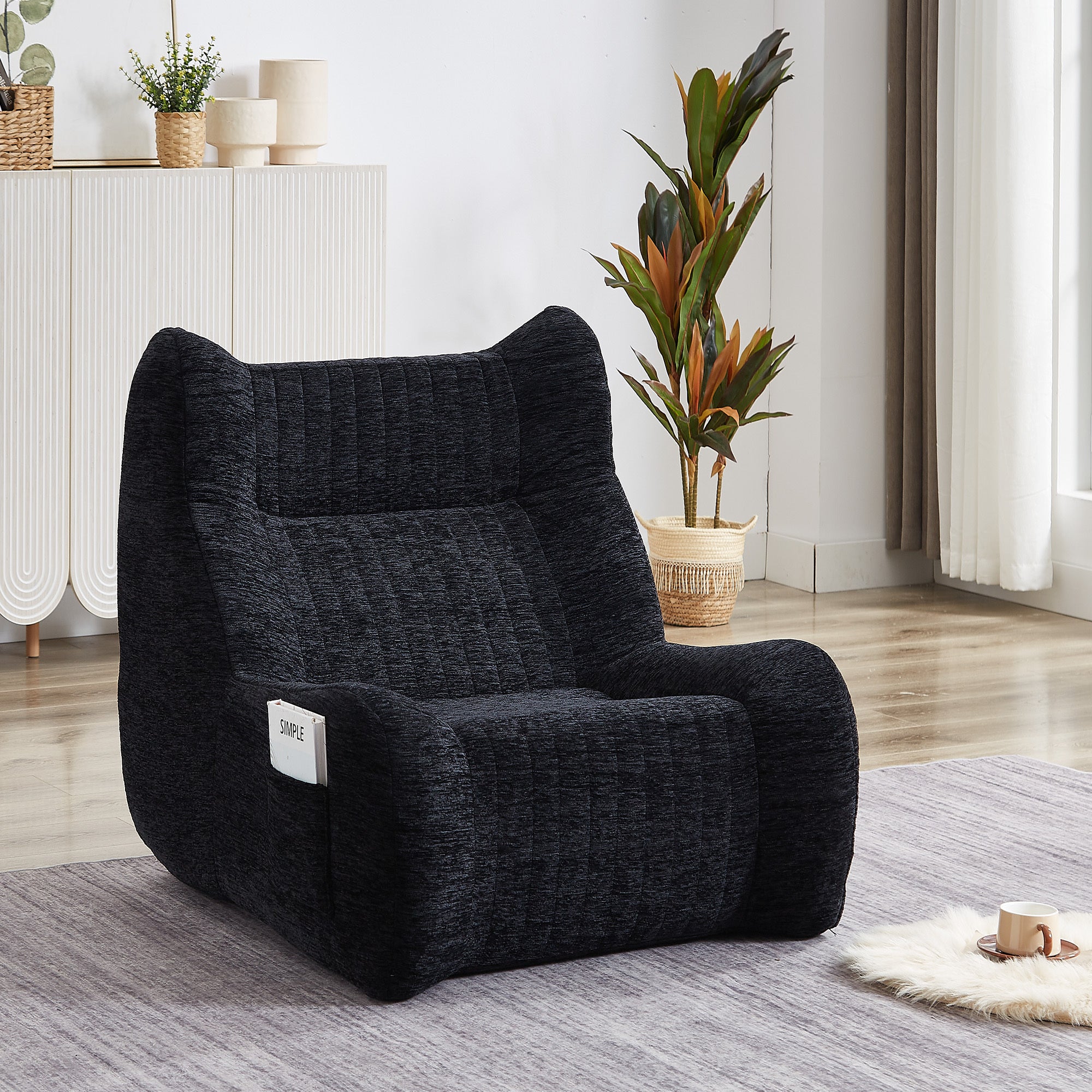 Oversized black floor sofa bean bag in living room setting