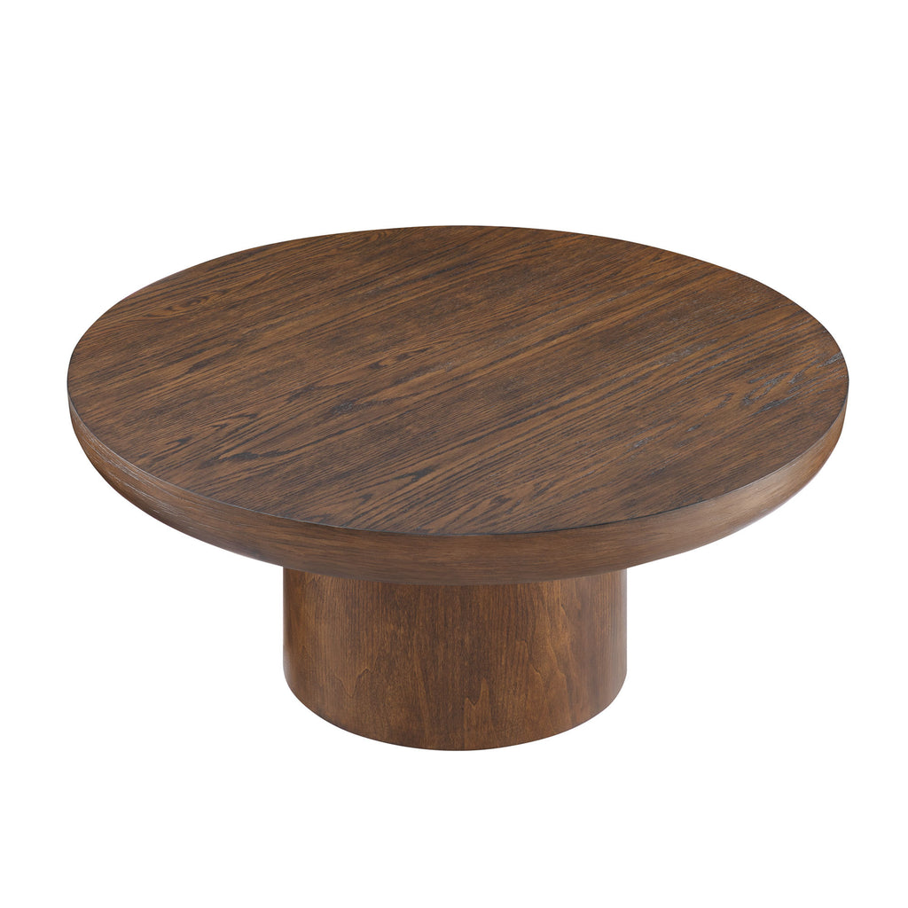 Dark brown round table with cylindrical legs in living room setting