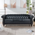 Black PU Chesterfield three-seater sofa — front view
