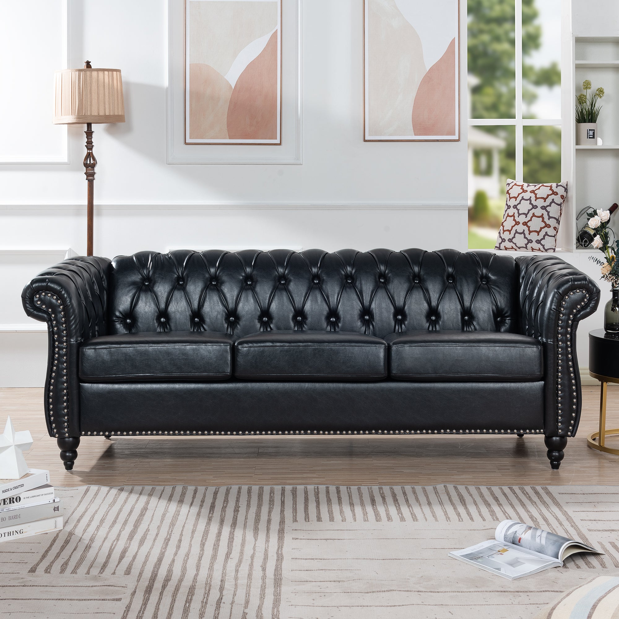 Black PU Chesterfield three-seater sofa — front view
