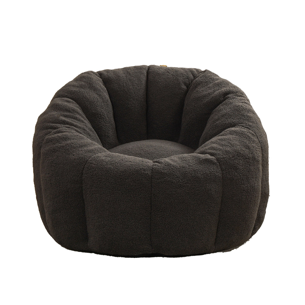 Dark gray bean bag sofa chair in bedroom setting