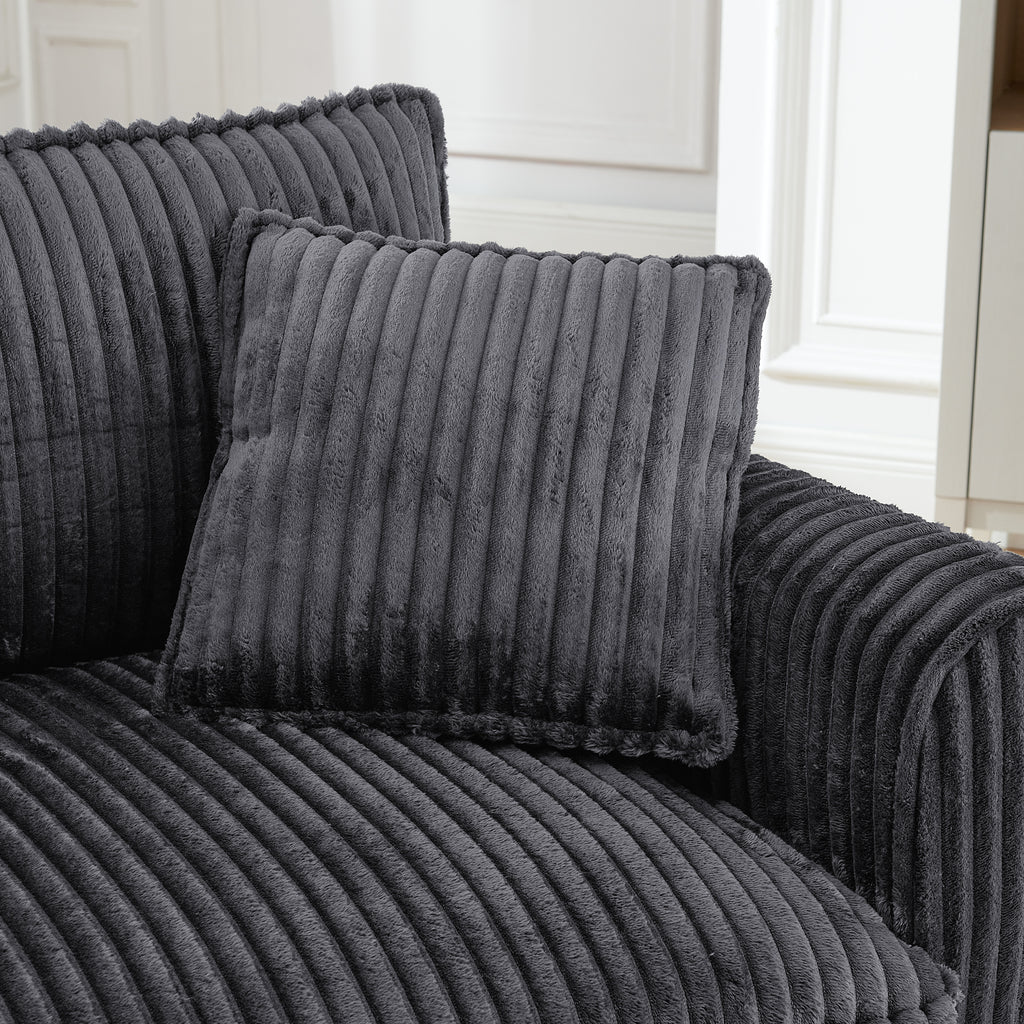 Gray tufted corduroy lounge chair in living room setting