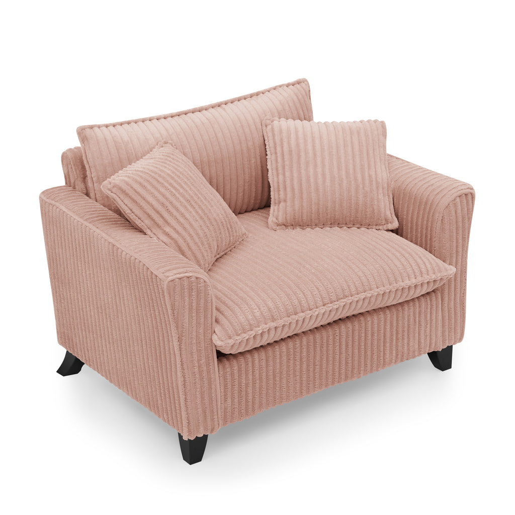 Pink corduroy sofa chair in bedroom corner