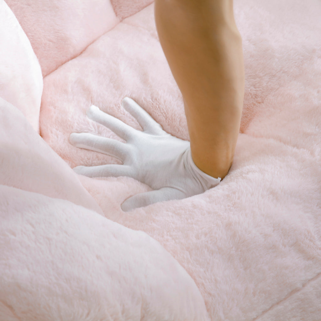 Pink bean bag chair in bedroom setting