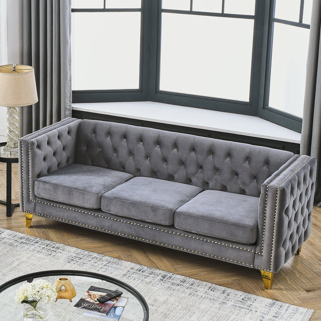 Button-tufted backrest and nailhead trim detail