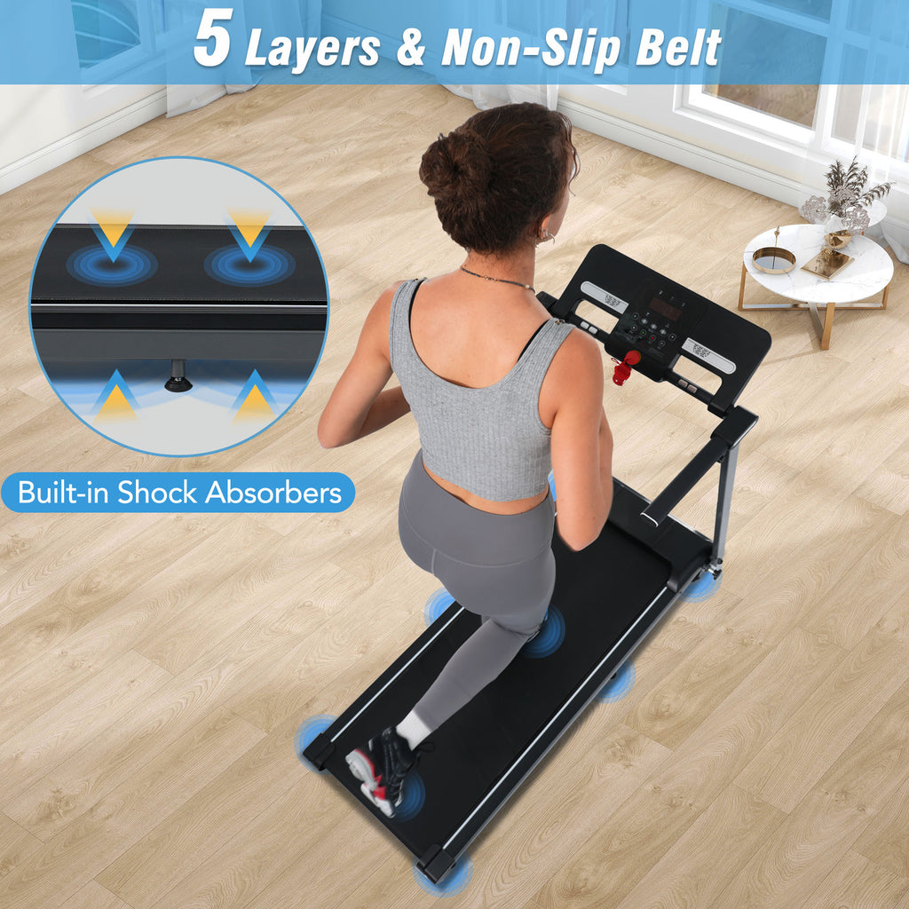 Compact foldable treadmill in small apartment living space