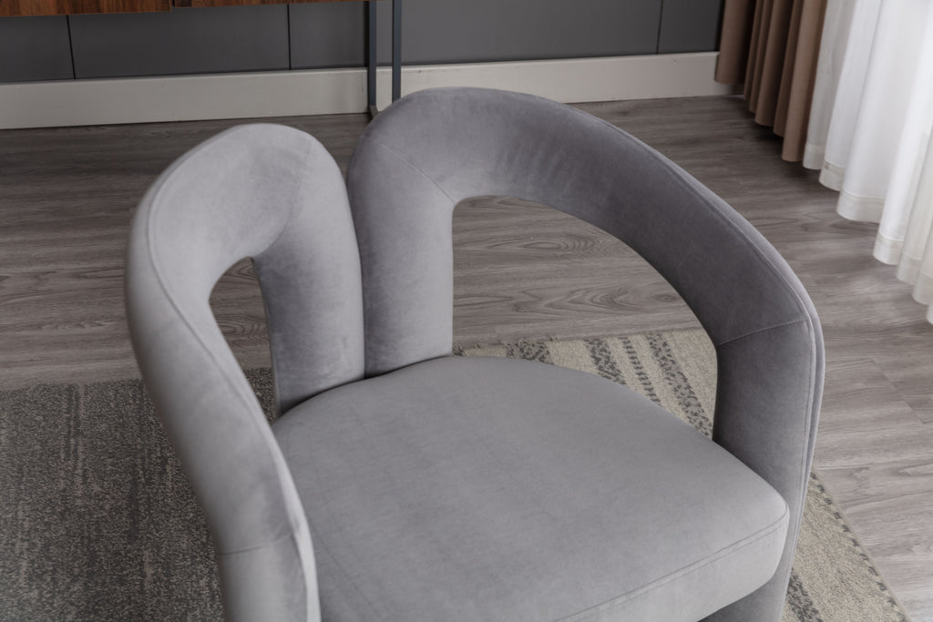 High-density foam seat on gray velvet barrel chair
