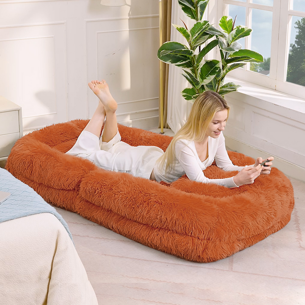 Orange human dog bed reclined reading position