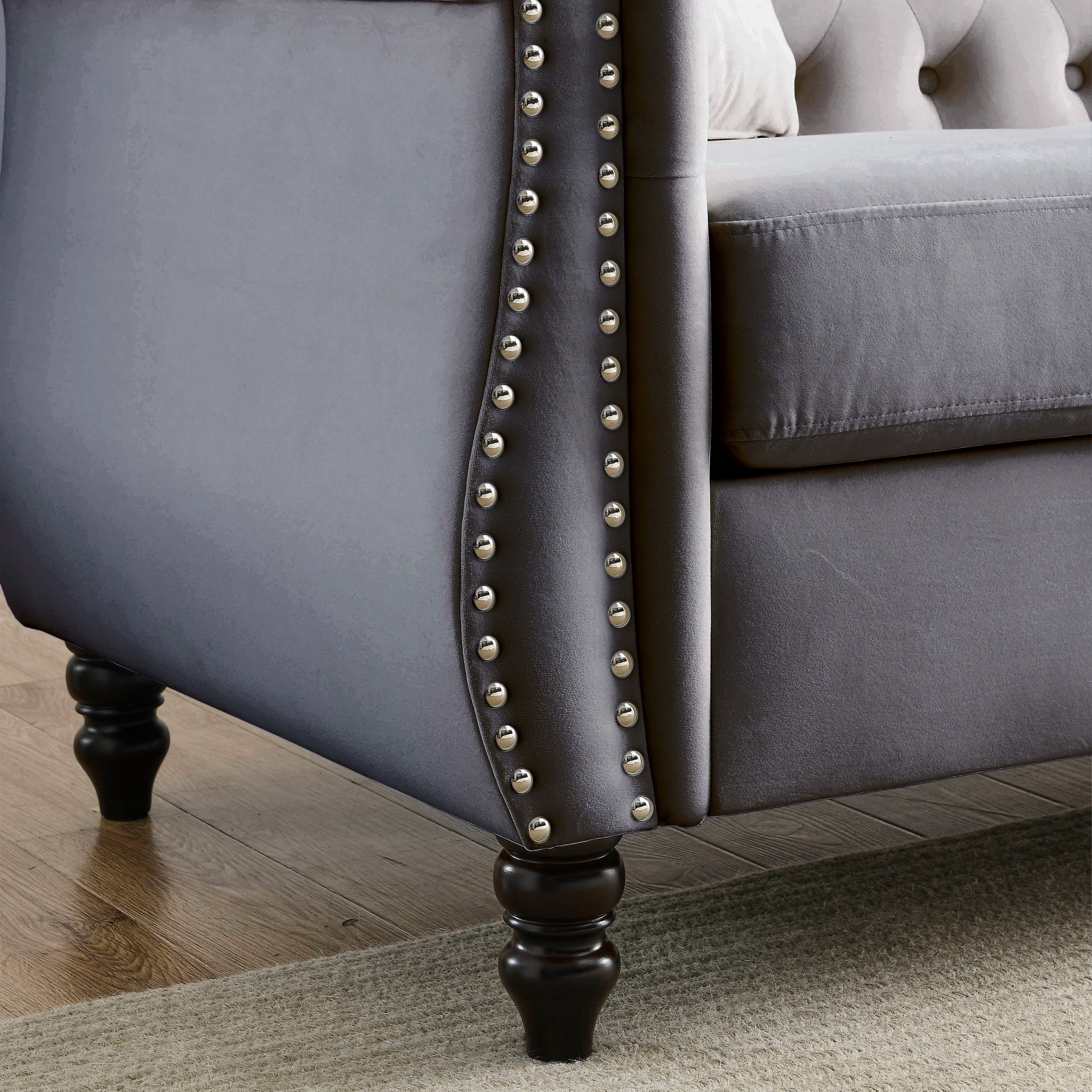 Nailhead trim along armrest close-up