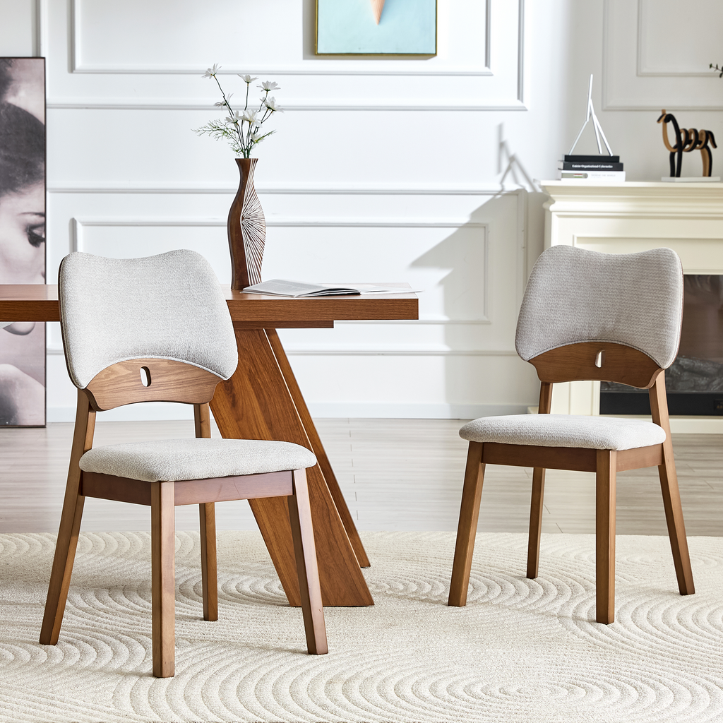 2 walnut colored solid wood dining chairs, with gray soft fabric packaging on the backrest and seat cushion, hollowed out design backrest, for home dining chairs.
