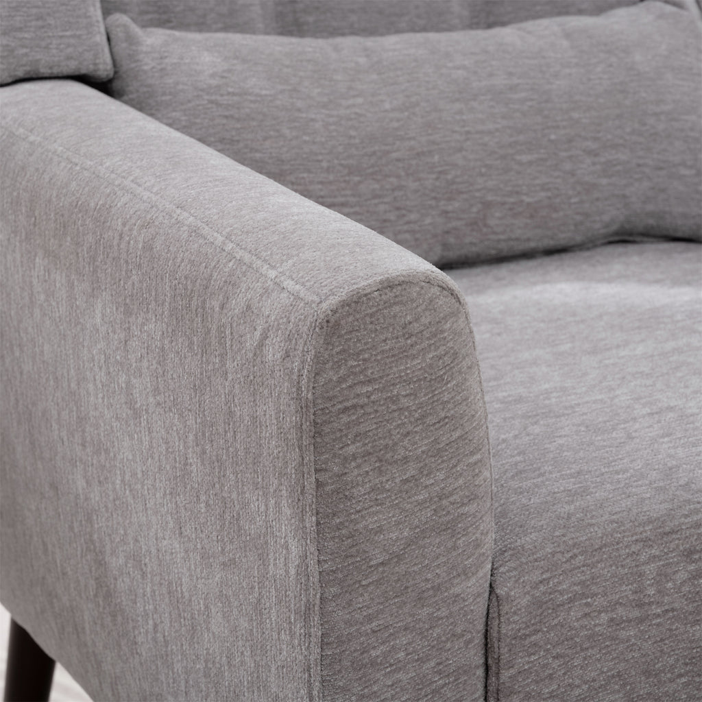Gray accent chair ergonomic back and arms — profile view